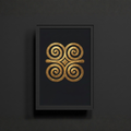 Framed artwork with a gold spiral design on a black background